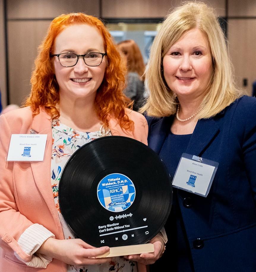 Dr. Tiffanie Waldeck and President and CEO Alison Croke Hold Award