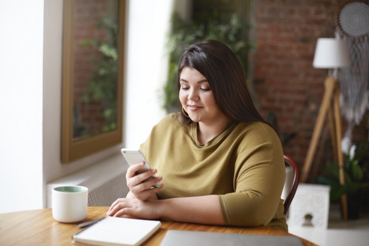 Woman-Looking-at-Cell-Phone